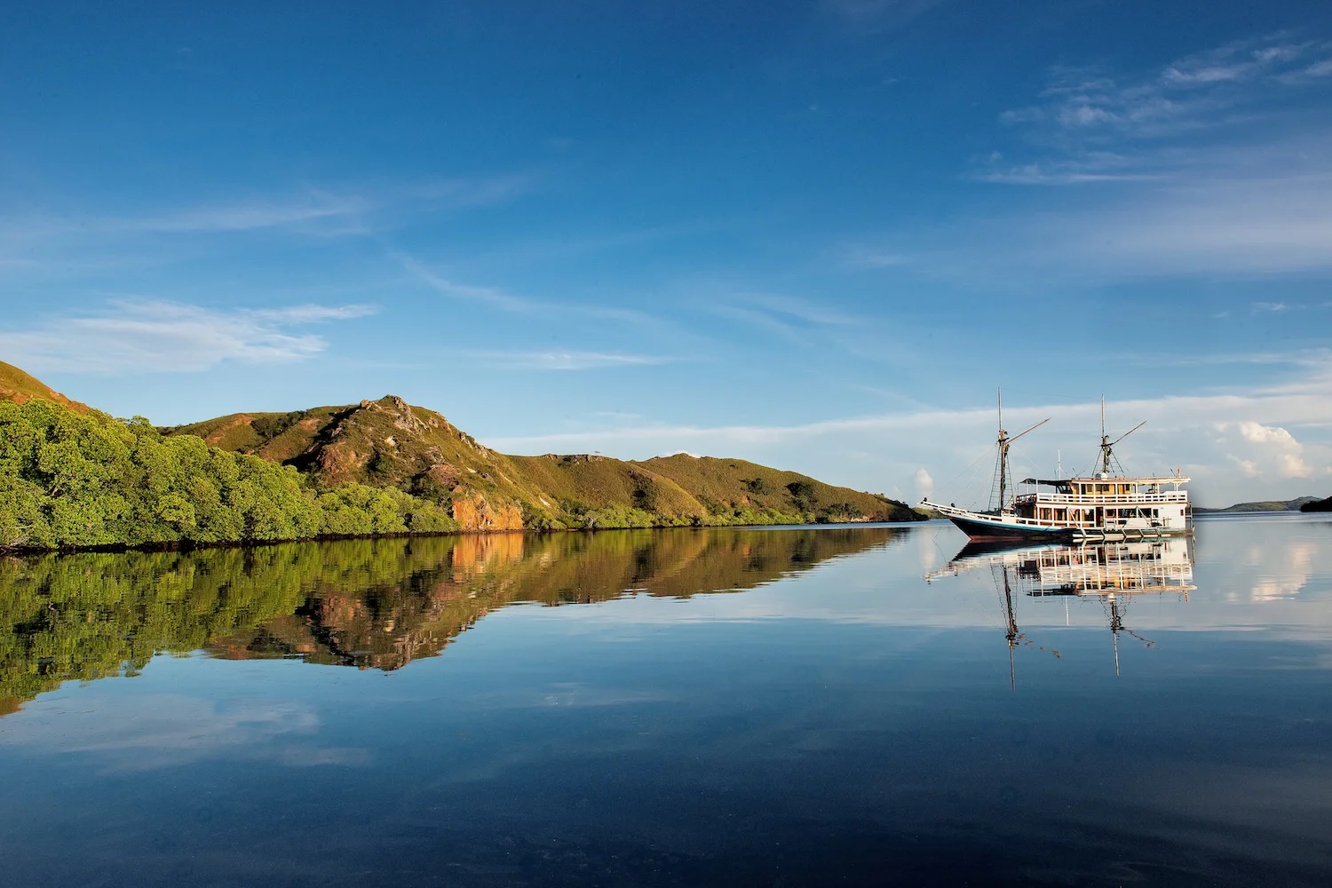 boat-reflection-with-blue-sky-2025-03-10-12-57-23-utc.webp