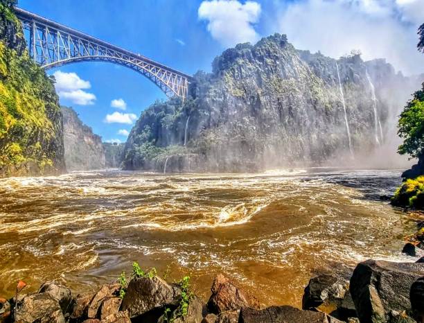 Victoria Falls Bridge crosses the Zambezi River just below the Victoria Falls
